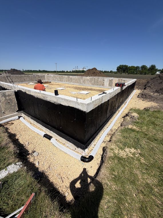 Completed basement foundation walls waiting on backfill