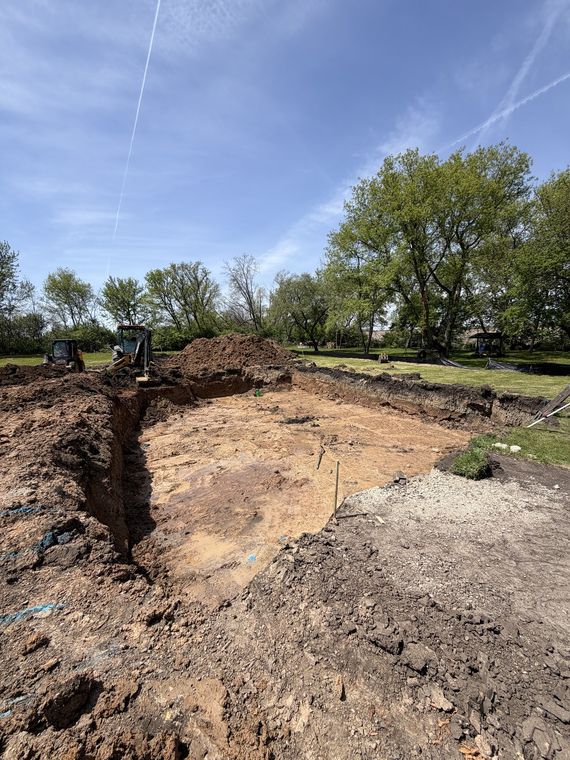 Excavated footings and trench work on a new construction site